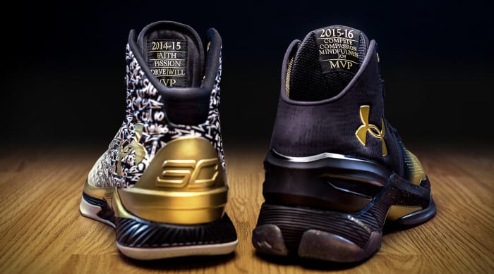 Rear view of Stephen Curry's white, black, and gold Under Armour shoes.